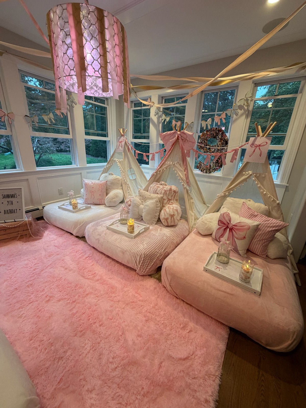 Pink bow tent sleepover with pink bedding and trays