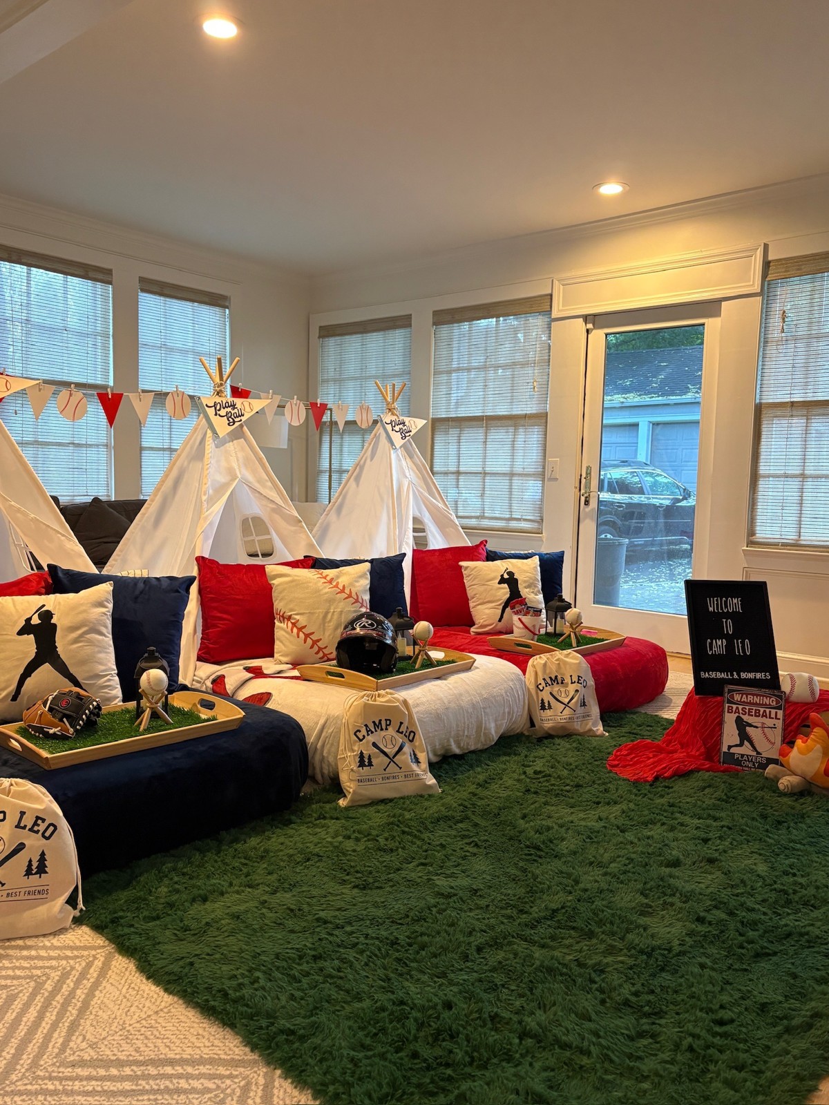 Sports-inspired tent sleepover with red and blue bedding